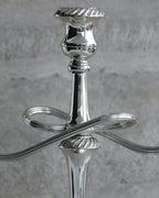Close-up of central column and sculptural arms of Italian silver plated candelabra