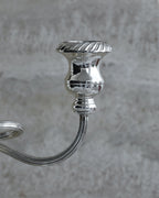 Side view of curved arm and candle holder in silver plated Italian candelabra