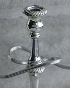 Top view of candle cup with fluted rim on vintage silver plated candelabra