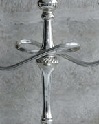 Close-up of twisted arm detail and central stem of 1970s Italian candelabra