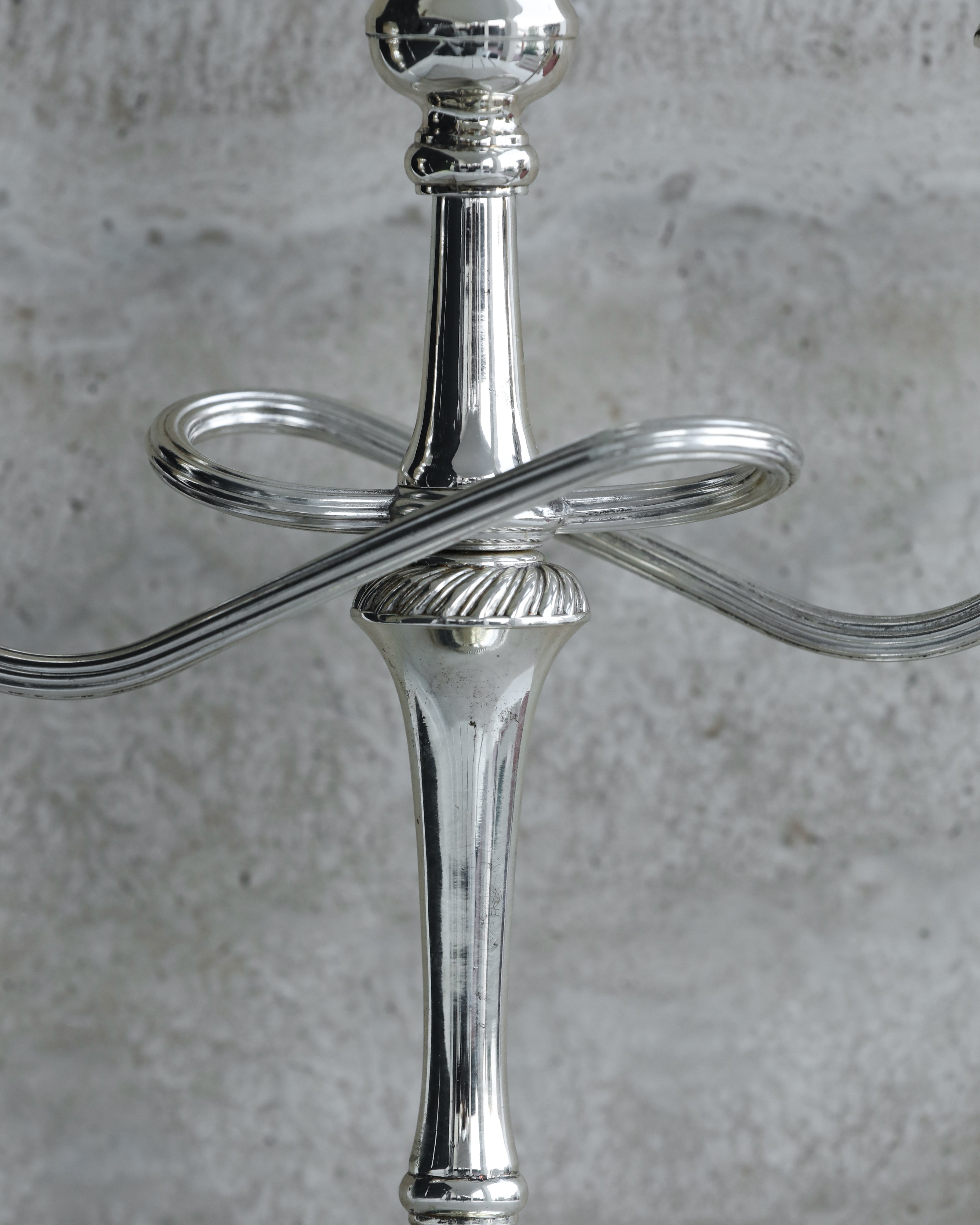 Close-up of twisted arm detail and central stem of 1970s Italian candelabra