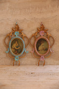 Pair of antique Italian portrait frames in turquoise and lilac with baroque scrollwork and gold accents