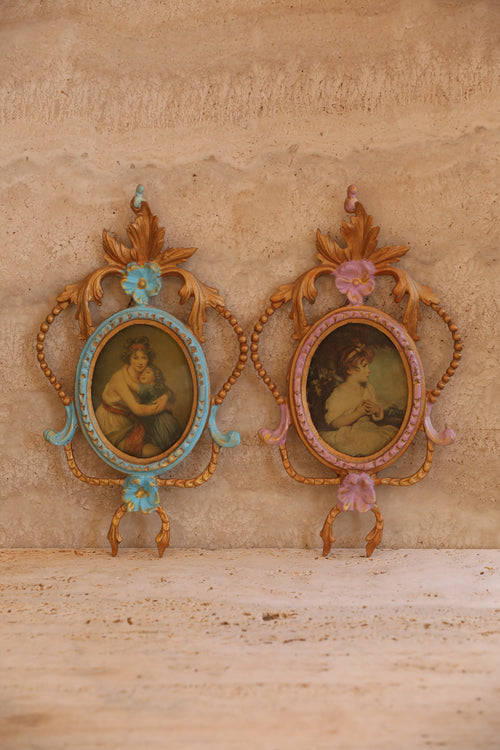 Pair of antique Italian portrait frames in turquoise and lilac with baroque scrollwork and gold accents