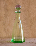 Front view of Carlo Moretti 1970s Murano glass perfume bottle in translucent green with spherical stopper