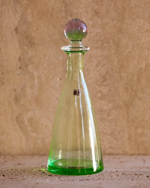 Front view of Carlo Moretti 1970s Murano glass perfume bottle in translucent green with spherical stopper