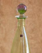 Detail of Carlo Moretti hand-blown glass stopper in gradient pink and green hues