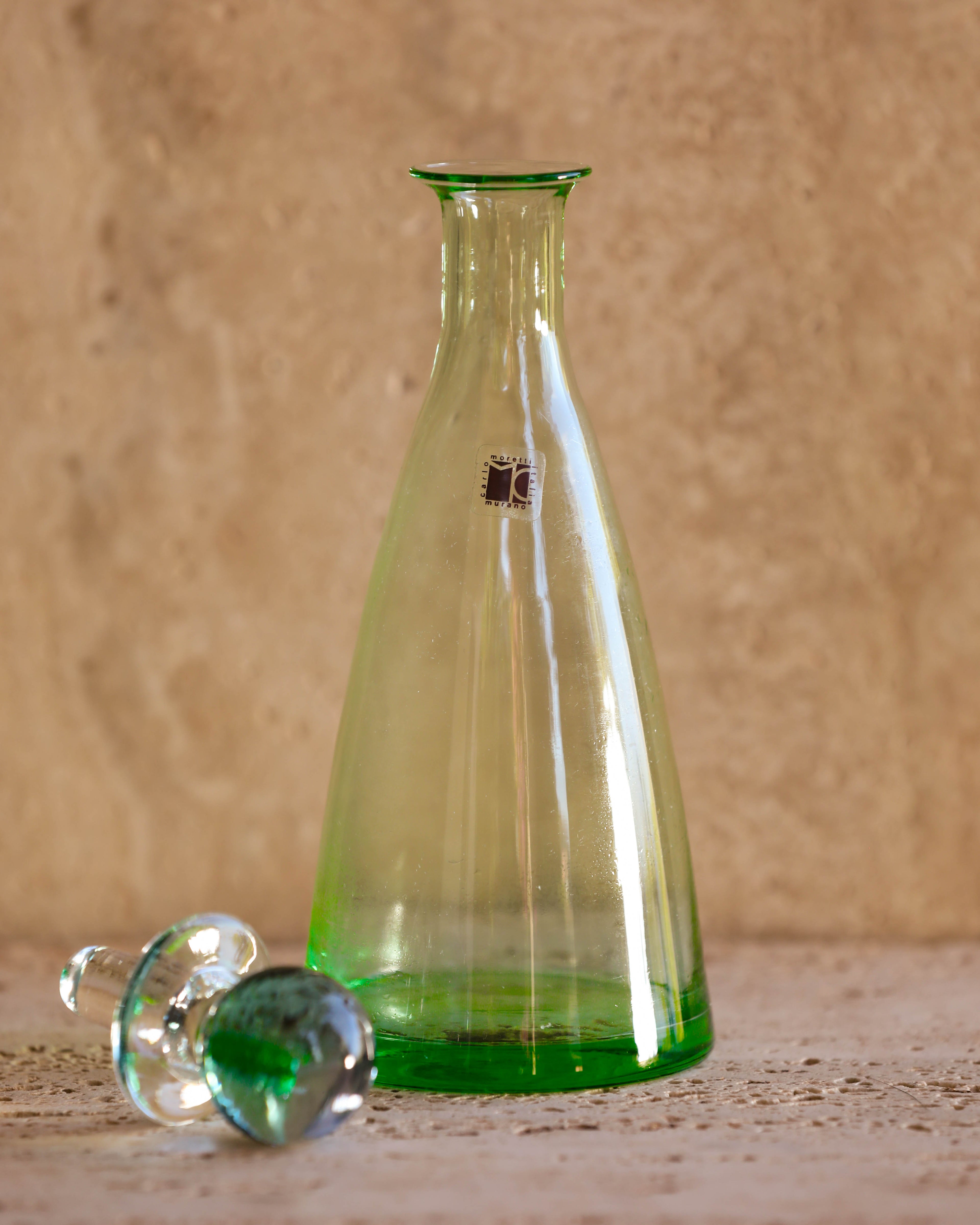 Close-up of Carlo Moretti Murano bottle showing pink-to-green gradient glass stopper