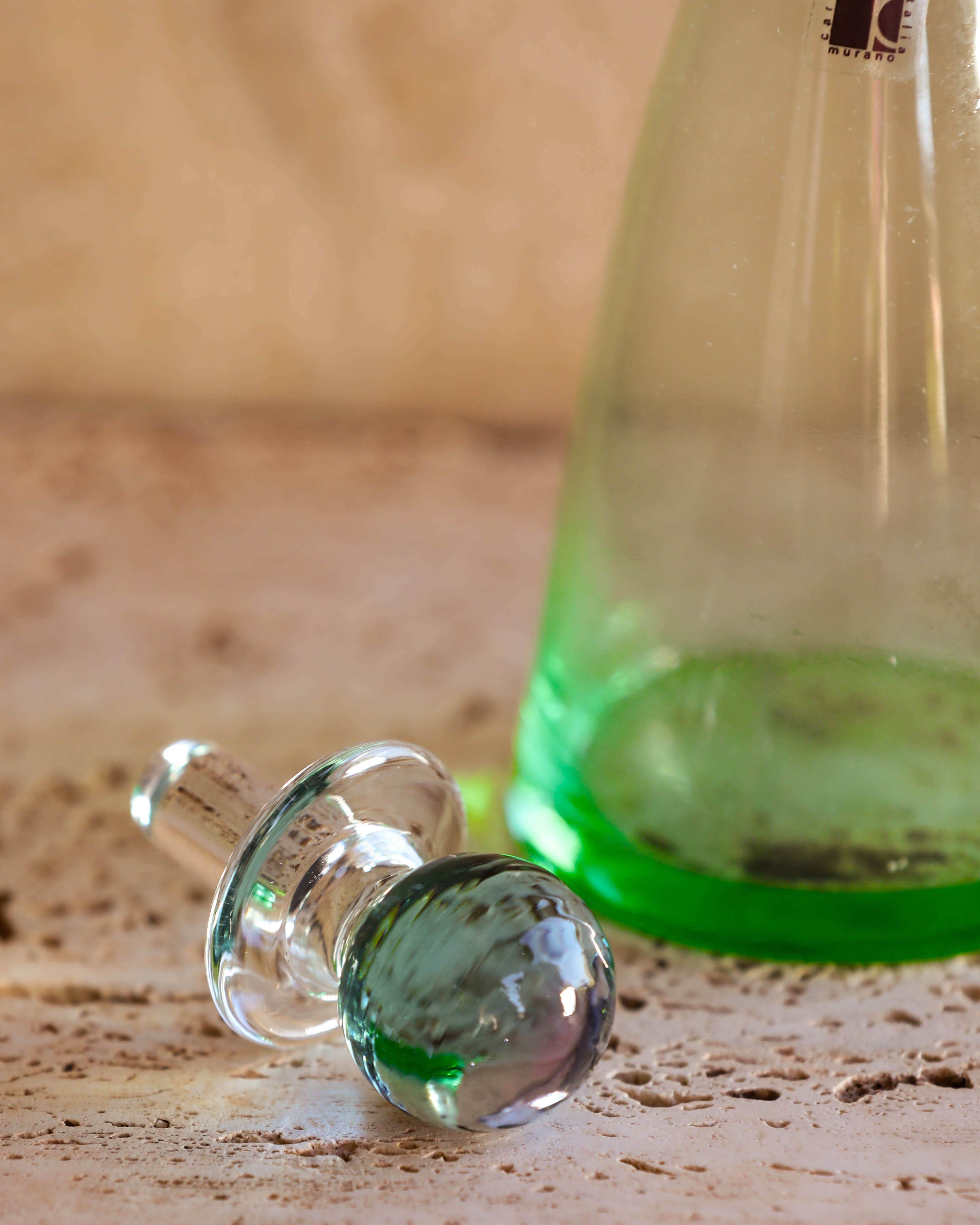 Murano glass bottle with stopper removed, displaying original Carlo Moretti label