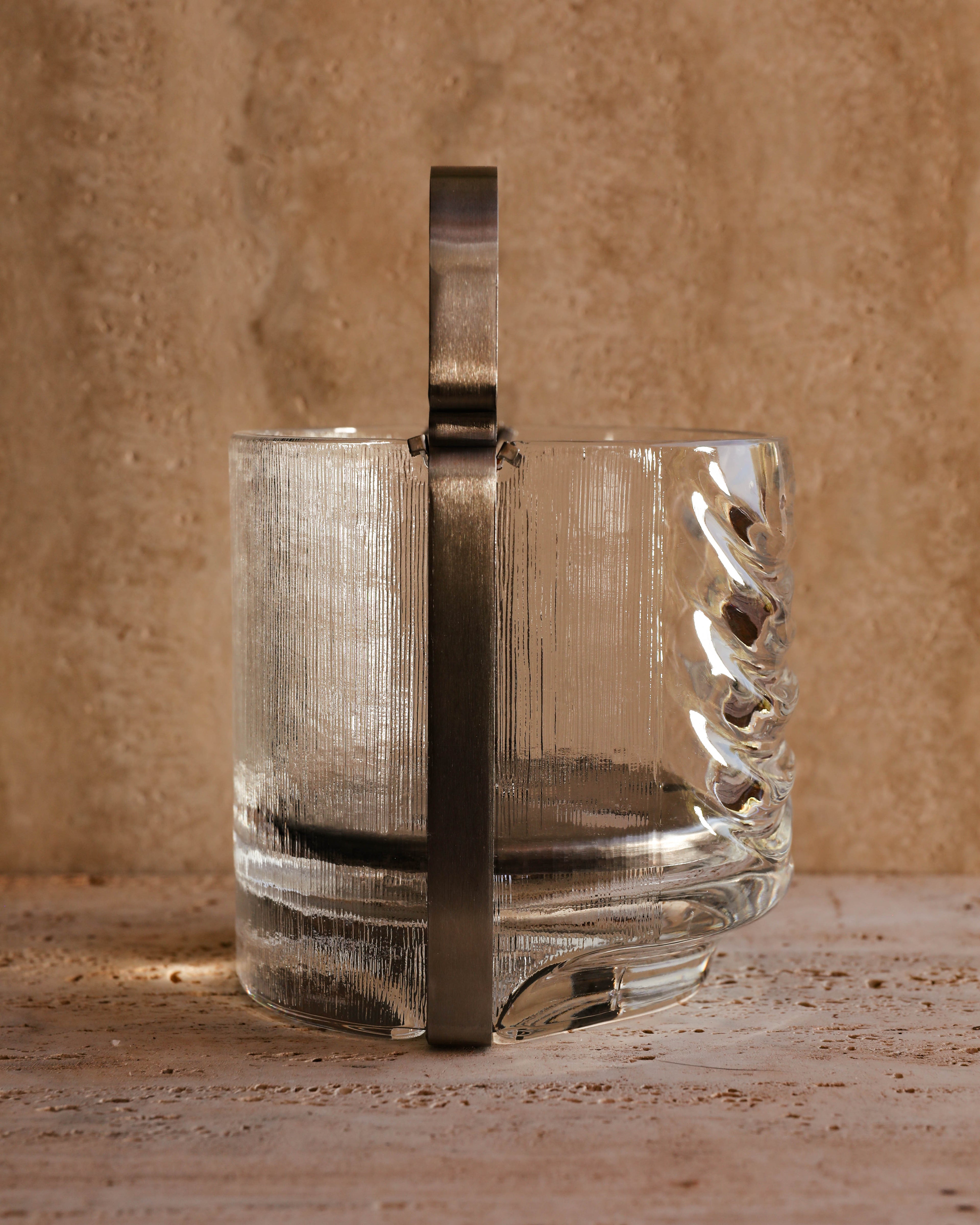 Profile view of Azteca glass ice bucket highlighting textured surface and metal handle connection — Italian collectible design