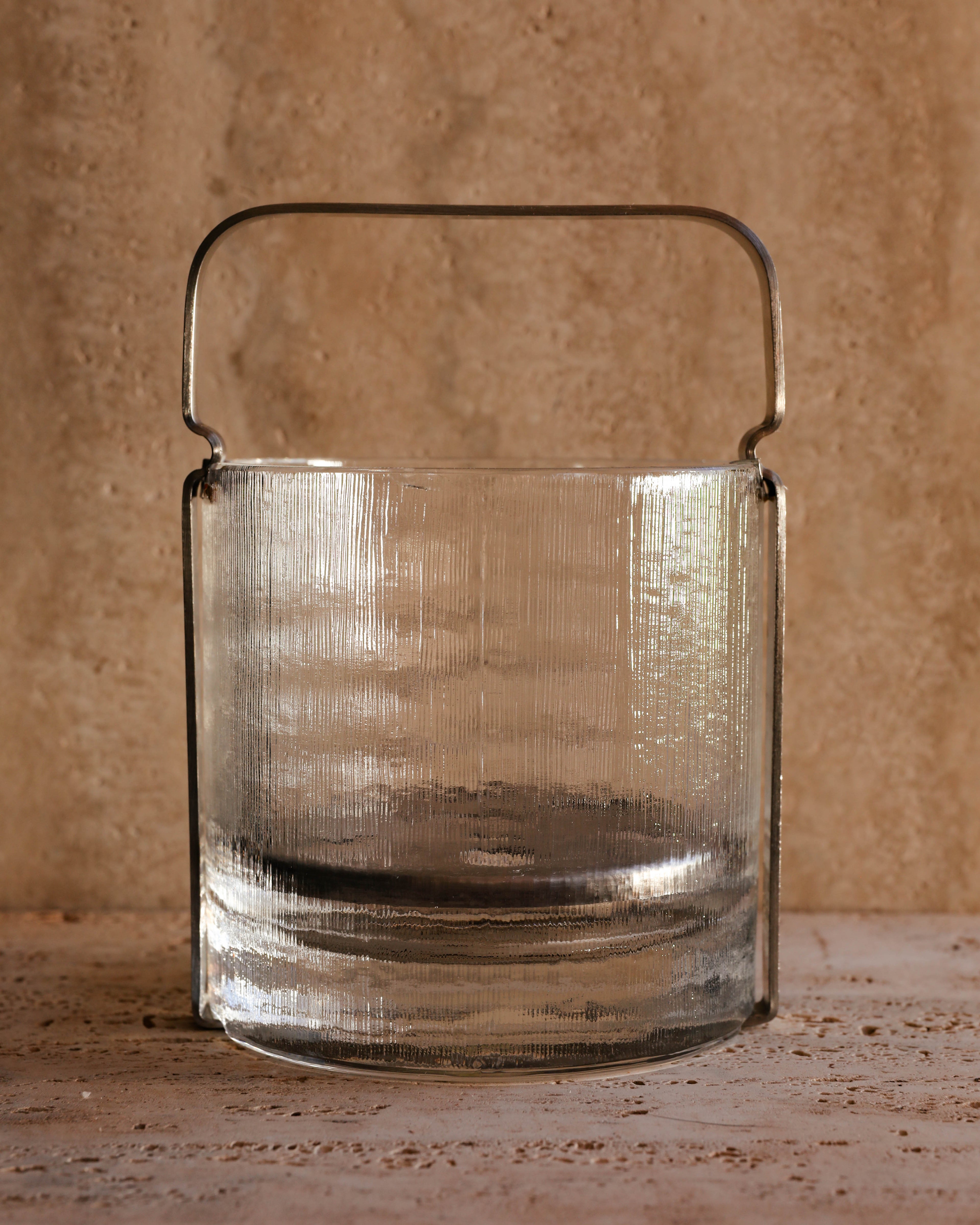 Back view of Arnolfo di Cambio Azteca glass ice bucket showing ribbed glass pattern and chrome frame, 1970s Italian craftsmanship