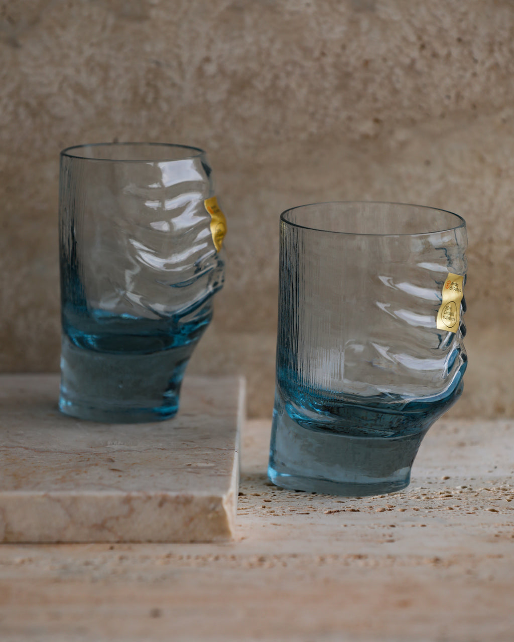 Pair of vintage Italian cobalt blue tumblers with sculpted glass texture by Fabio Frontini for Arnolfo di Cambio.