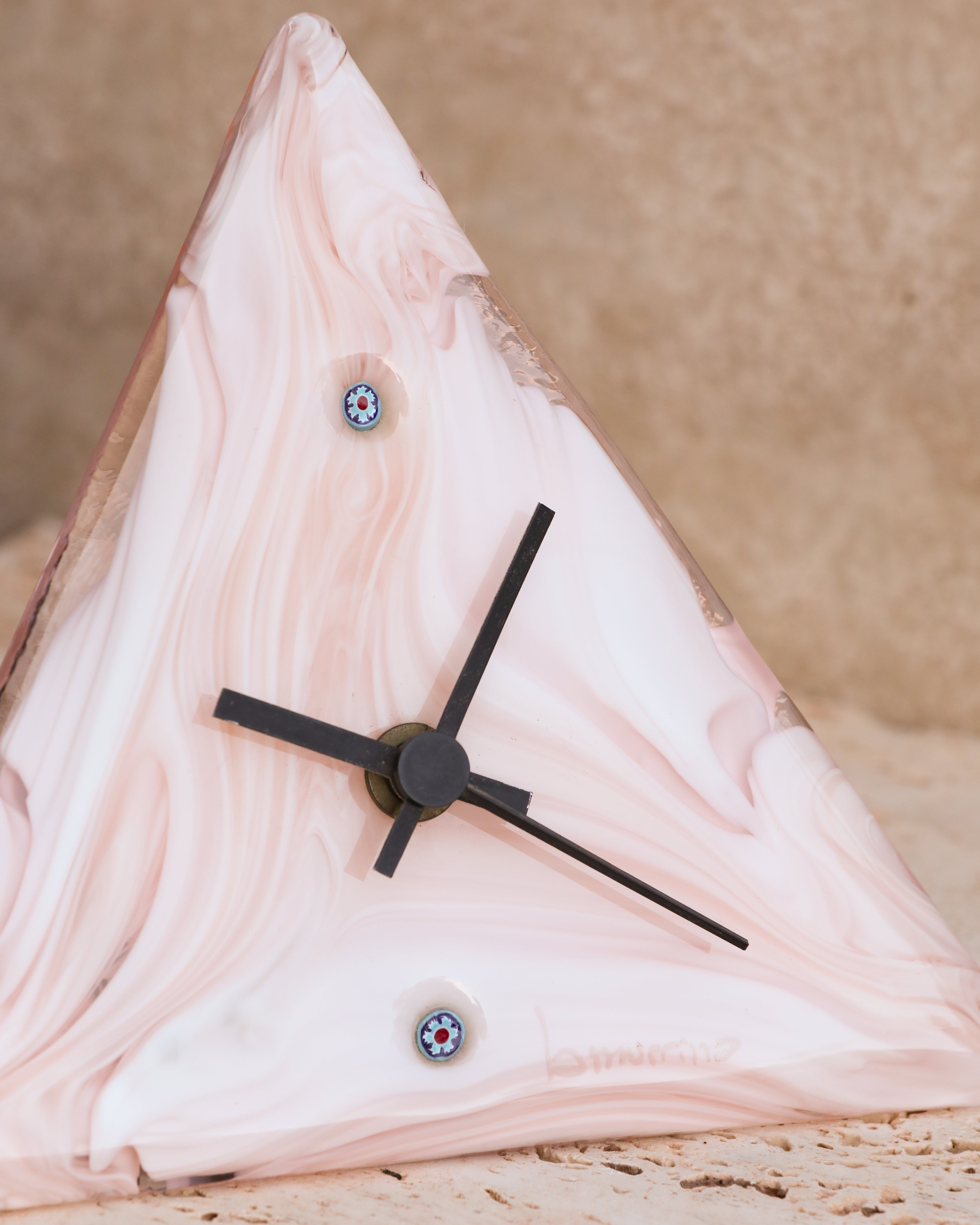 Close-up of La Murrina Murano glass clock showing marbled glass texture and black hands