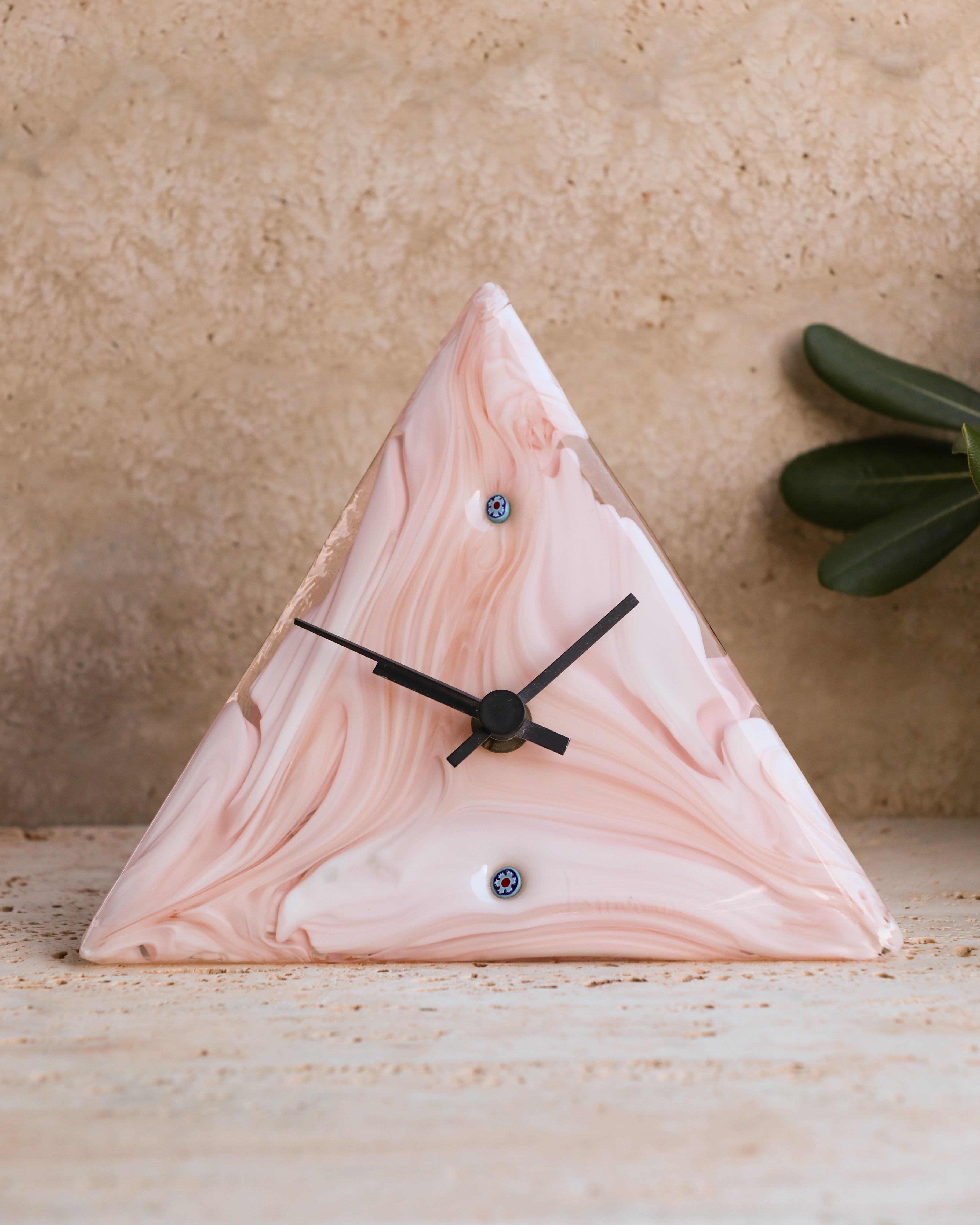 Front view of 1970s La Murrina Murano glass triangular clock in pink and white swirl with Millefiori accents