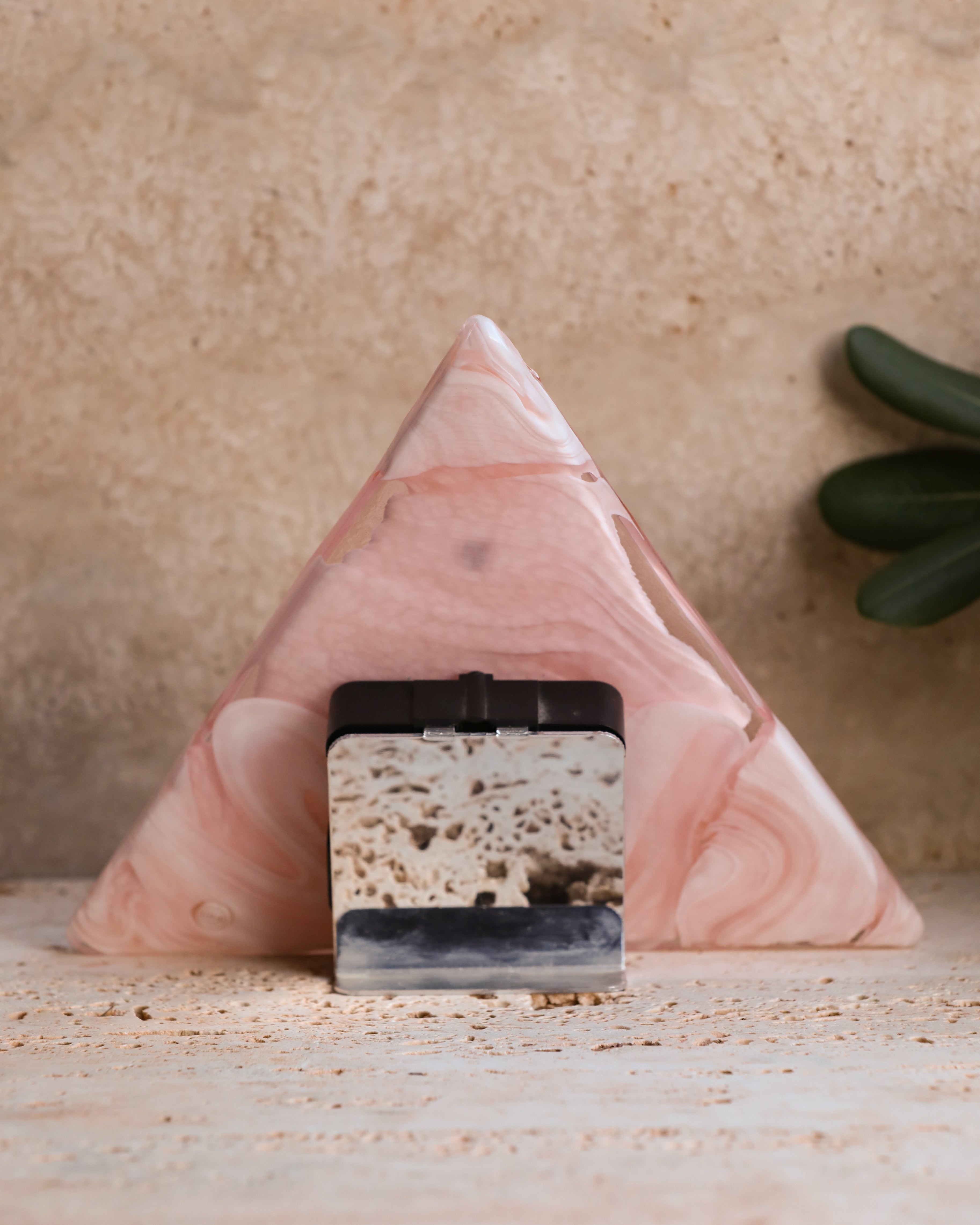 Back view of La Murrina vintage glass clock with metal stand and working mechanism