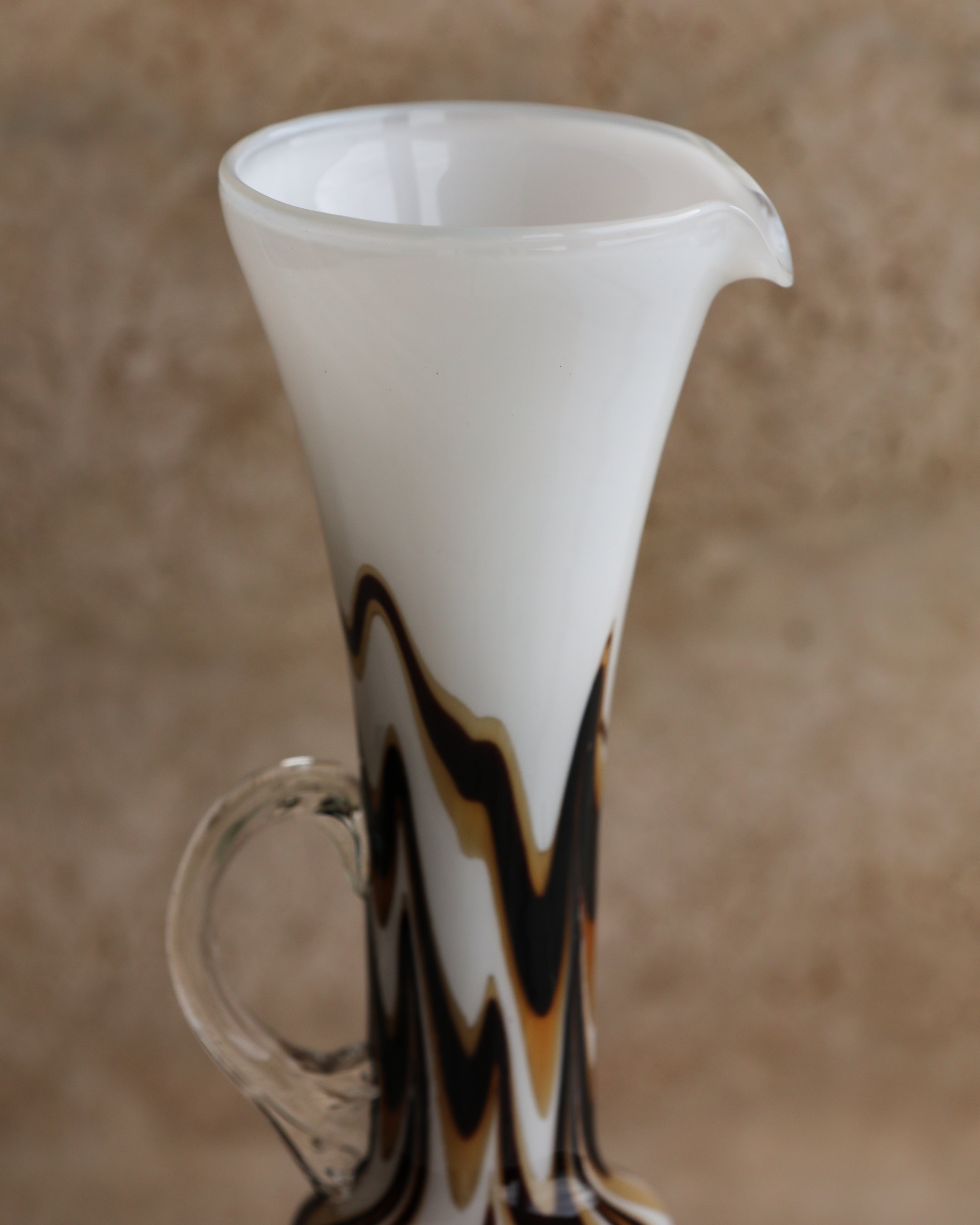Detail of the fluted white glass spout on the Carlo Moretti Murano pitcher.