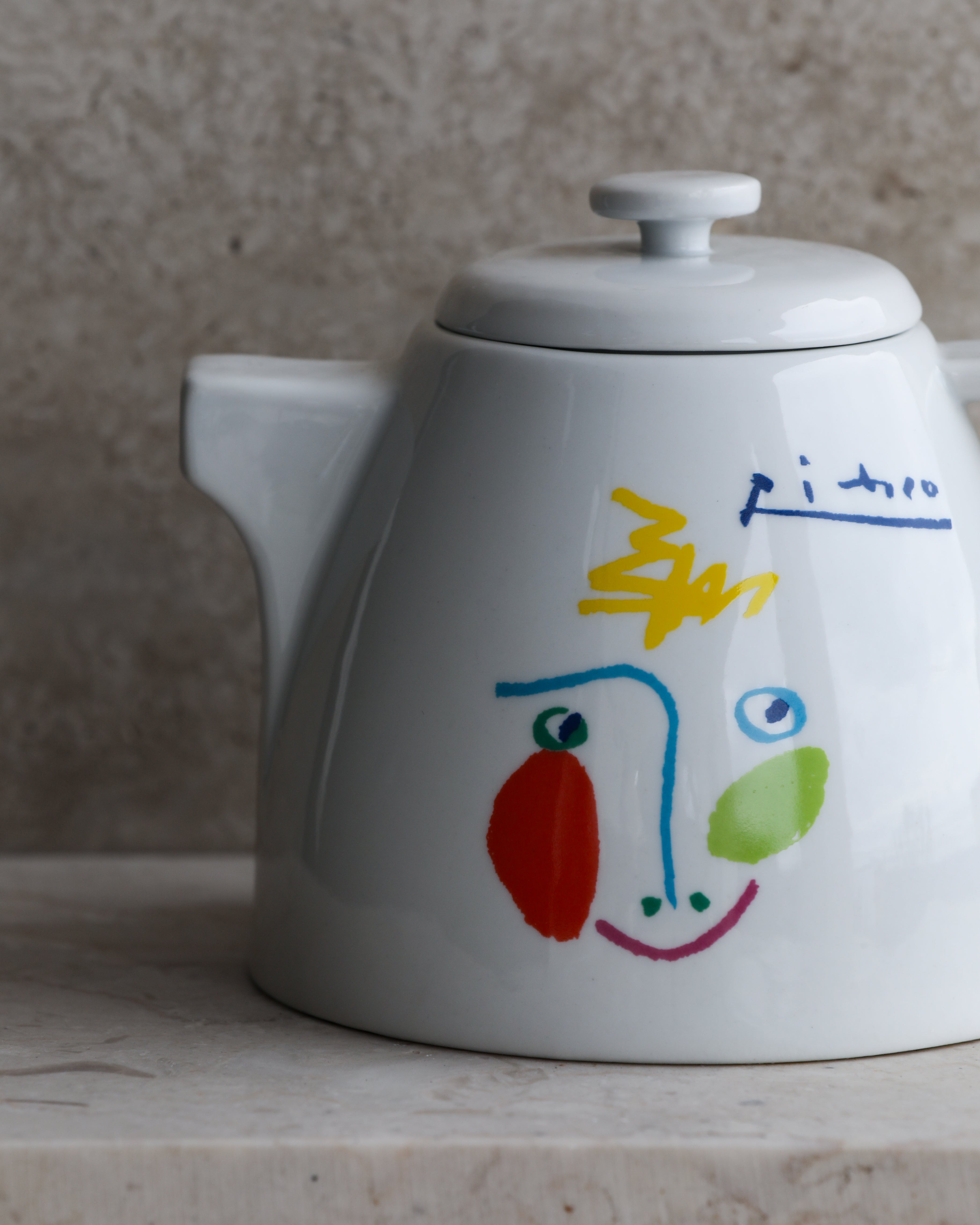 Close-up of Picasso La Lavandière design on porcelain kettle and spout