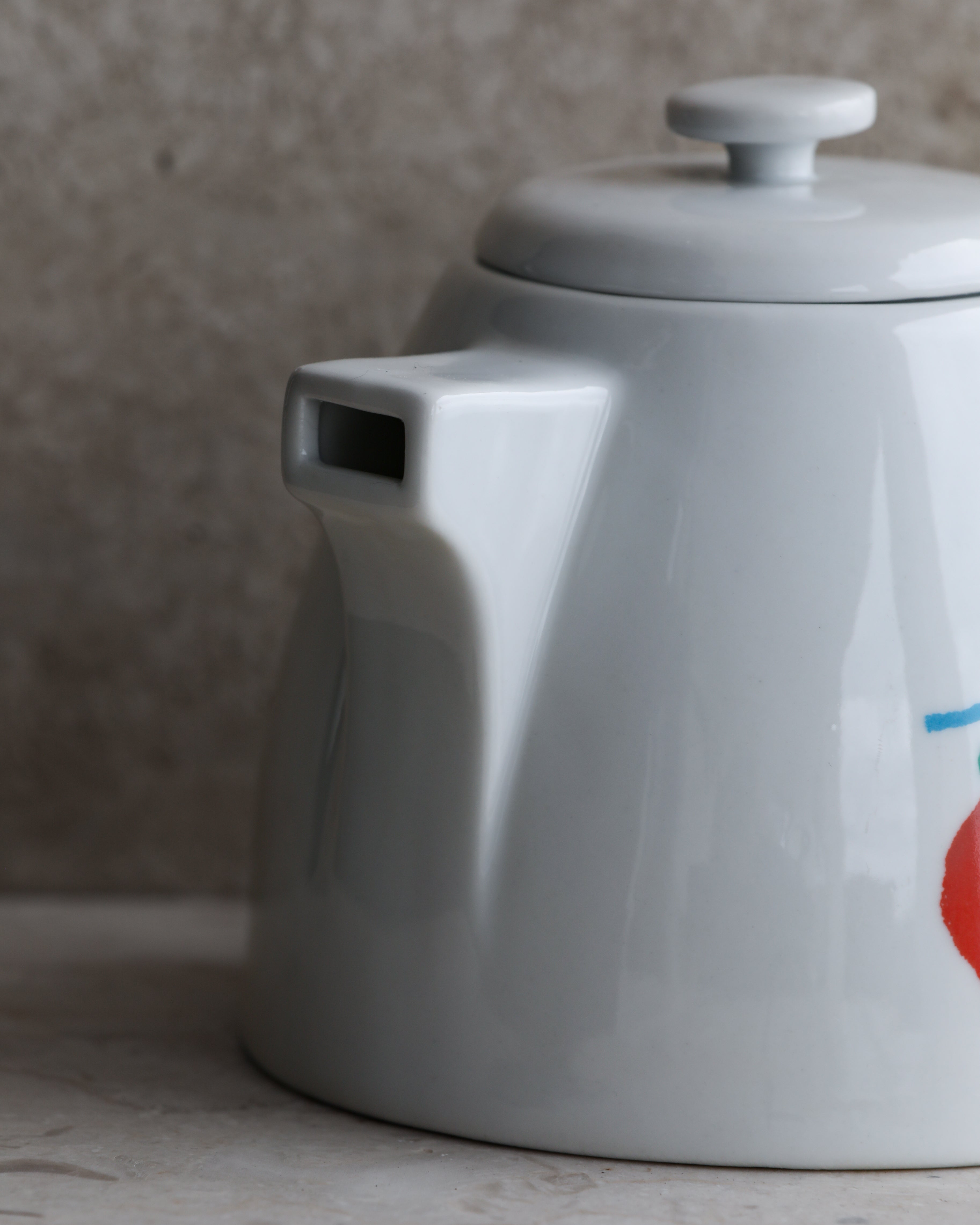 Side view of vintage Italian porcelain kettle spout detail