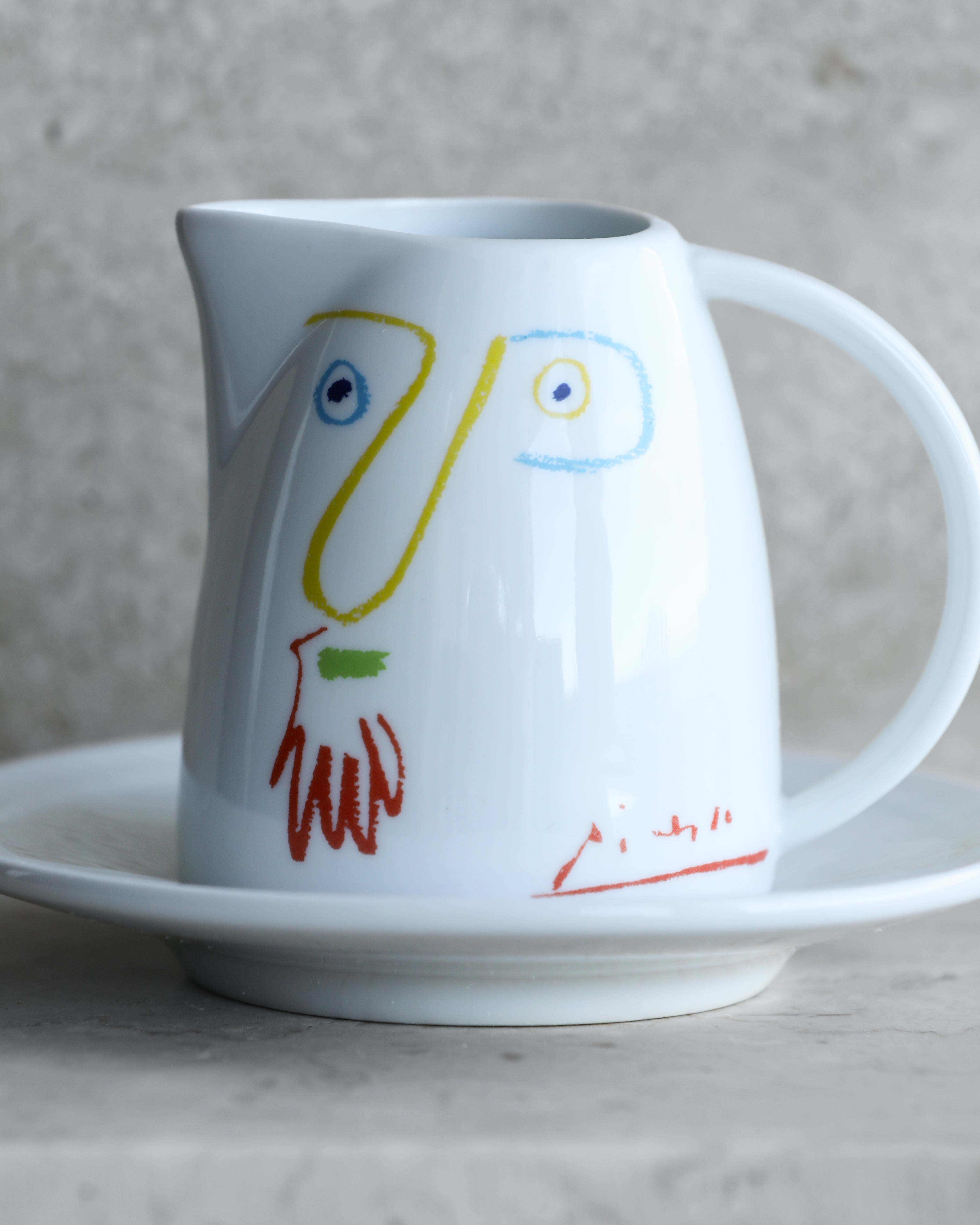 Close-up of Picasso line drawing detail on vintage Italian porcelain milk jug