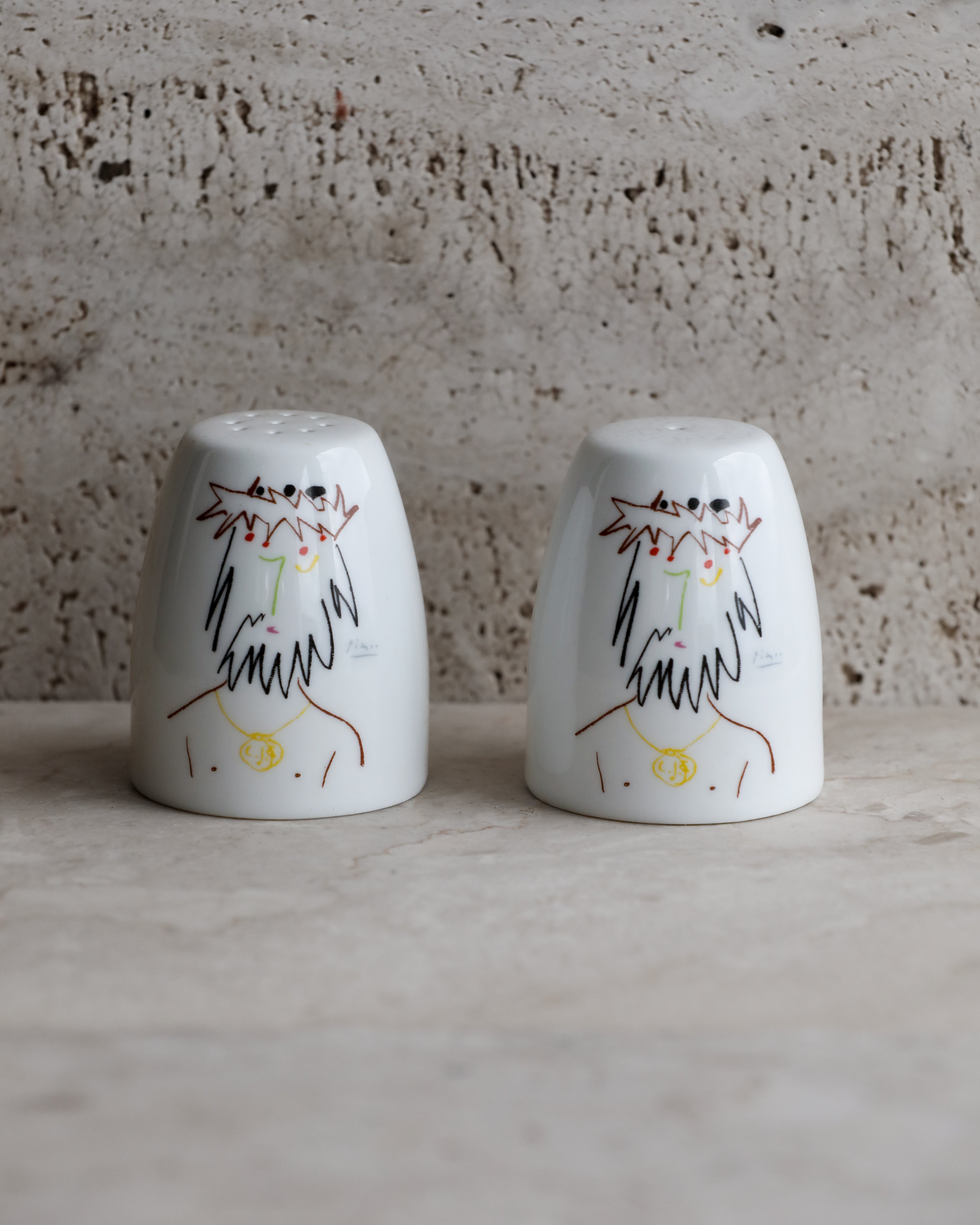 Tognana Picasso salt and pepper shakers side by side on stone surface